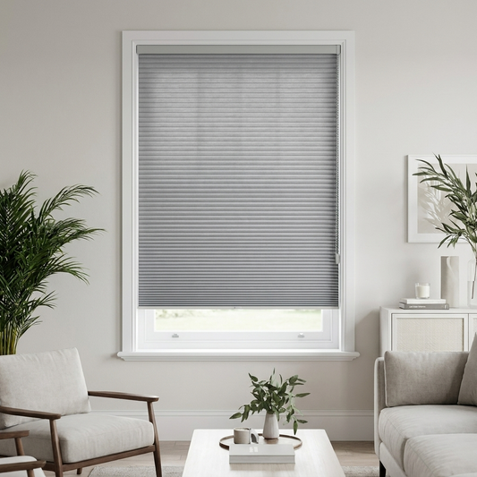 Ready-made honeycomb cellular blind in Dove Grey on a bright window